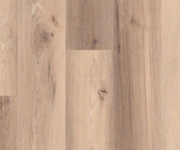 Close-up of a light wood floor with visible grain and knots in varied planks.",