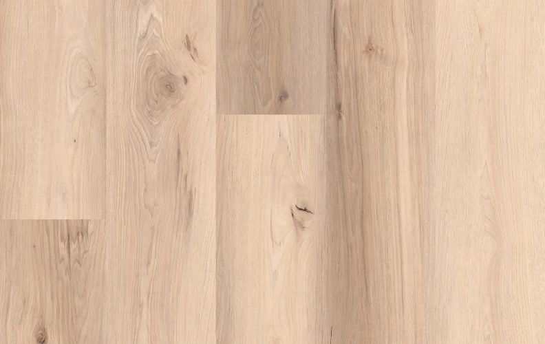 Light oak hardwood floor with visible grain and plank seams.
