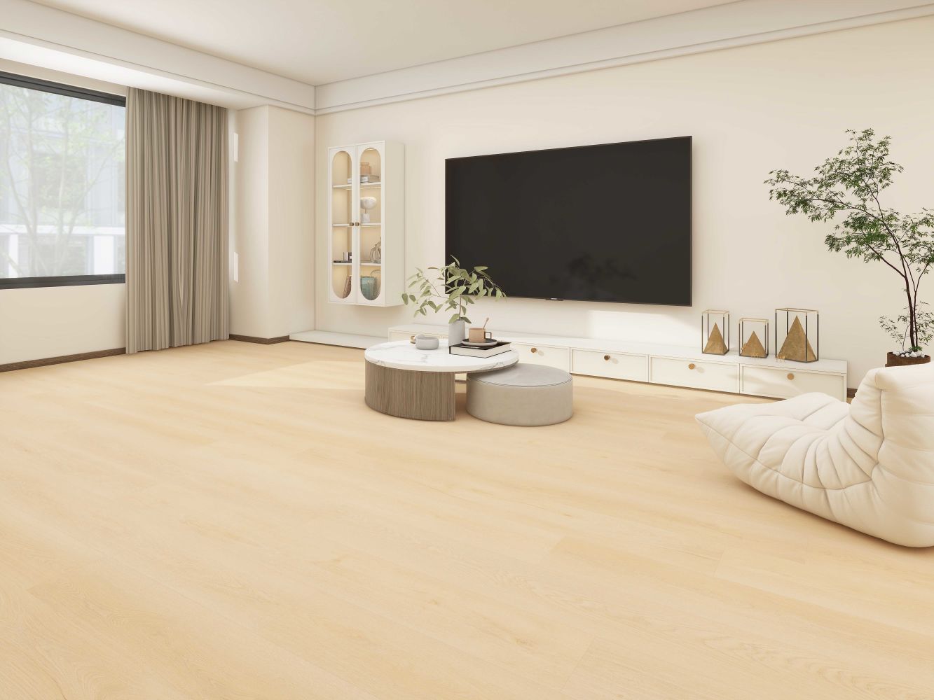 Bright modern living room with a large wall-mounted TV, white storage unit, and a round marble-top coffee table on light wood floors.