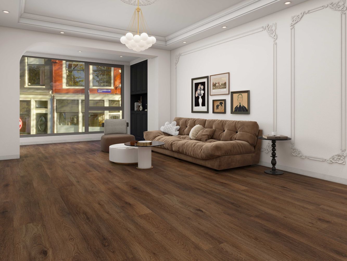 Cozy living room with a brown tufted sofa, white wall molding, and a gallery wall near a large window with a city street view.