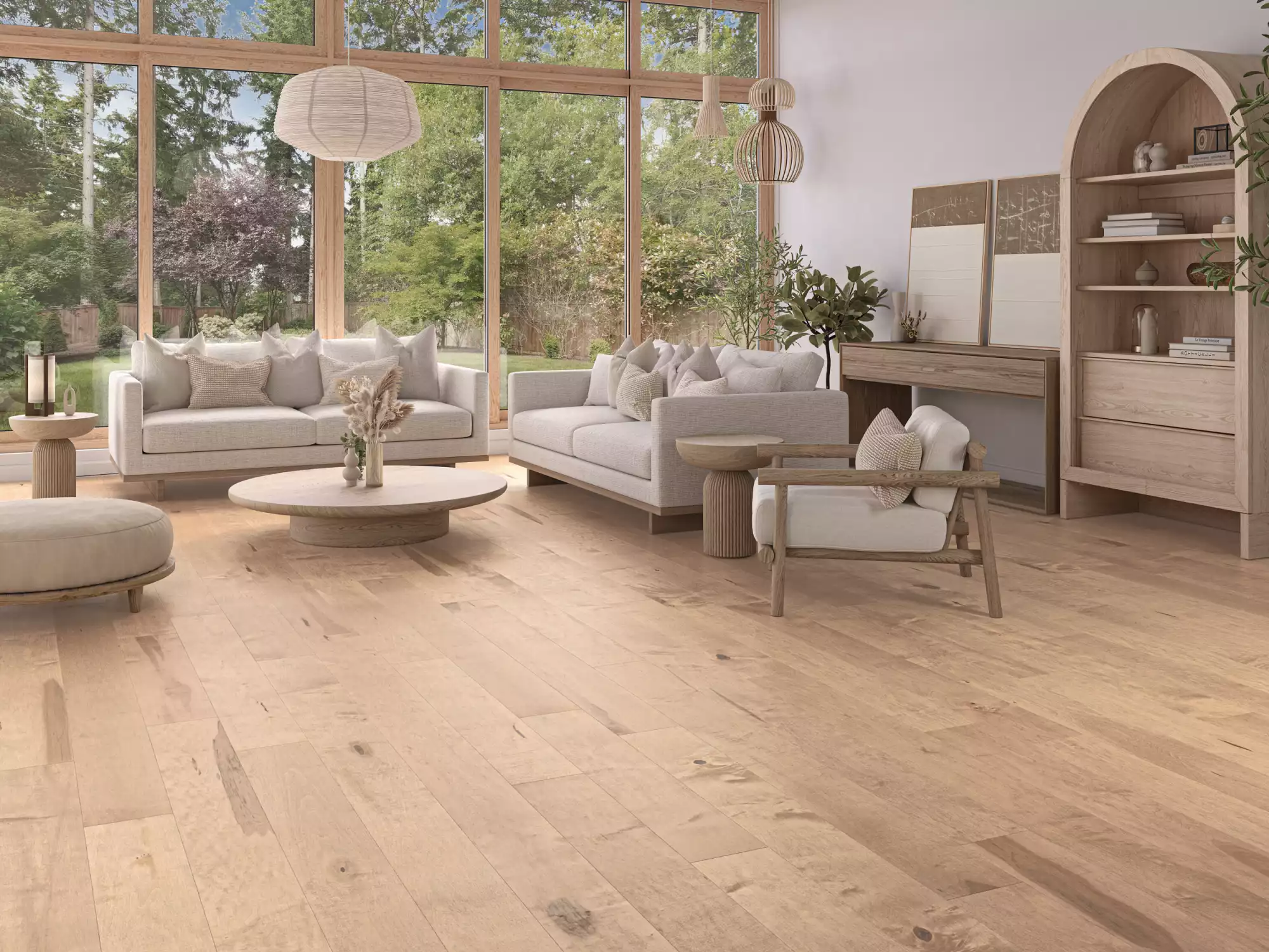 Sunlit living room with large wooden-framed windows opening to a green garden, neutral beige sofas, round coffee tables, and tall wooden shelves.