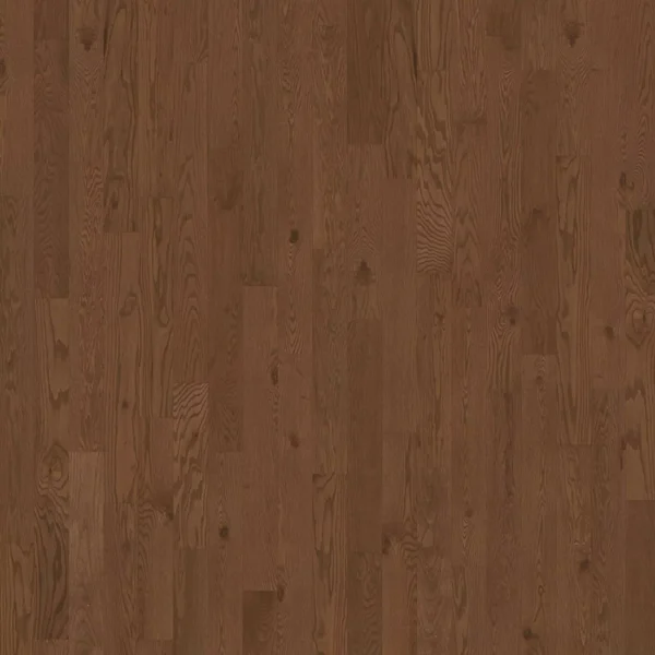 Close-up of a warm brown hardwood floor with visible grain patterns and planks laid in a staggered pattern.